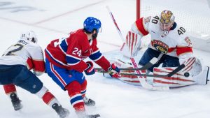 Florida Panthers goaltender Daniil Tarasov (40) makes a save against Montreal Canadiens' Phillip Danault (24) as Panthers' Tobias Bjornfot (22) defends during second period NHL hockey action in Montreal on Tuesday, April 7, 2026. (Christinne Muschi/CP)