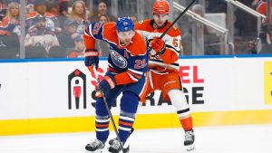 Anaheim Ducks' Cutter Gauthier (61) battles against Edmonton Oilers' Leon Draisaitl (29) during first period NHL playoff action in Edmonton on Monday, April 20, 2026. (Codie McLachlan/CP)