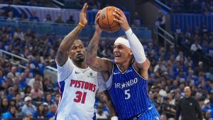 Orlando Magic forward Paolo Banchero (5) drives to the basket against Detroit Pistons guard Javonte Green (31) during the second half in Game 4 of a first-round NBA basketball playoff series, Monday, April 27, 2026, in Orlando, Fla. (John Raoux/AP)