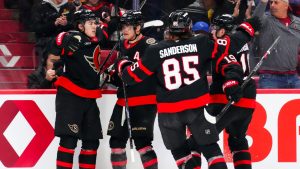 Ottawa Senators' Jordan Spence (left), celebrates a goal with teammates while taking on the Tampa Bay Lightning during second period NHL hockey action in Ottawa on Tuesday, April 7, 2026. (Sean Kilpatrick/CP)