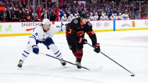 Ottawa Senators' Stephen Halliday (83) moves the puck around Toronto Maple Leafs' Simon Benoit (2) during second period NHL hockey action in Ottawa on Wednesday, April 15, 2026. (Sean Kilpatrick/CP)