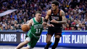 Boston Celtics' Payton Pritchard, left, tries to get past Philadelphia 76ers' Dominick Barlow during the first half of Game 4 in a first-round NBA playoffs series Sunday, April 26, 2026, in Philadelphia. (AP/Matt Slocum)