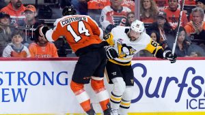 Philadelphia Flyers' Sean Couturier, left, and Pittsburgh Penguins' Erik Karlsson collide during the first period of Game 6 in the first round of the NHL hockey Stanley Cup playoffs series Wednesday, April 29, 2026, in Philadelphia. (Matt Slocum/AP)