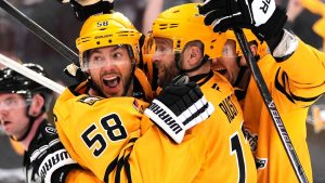 Pittsburgh Penguins' Kris Letang (58) celebrates with Bryan Rust, center, after scoring during the second period of Game 5 in the first round of an NHL hockey Stanley Cup playoff series against the Philadelphia Flyers in Pittsburgh, Monday, April 27, 2026. (Gene J. Puskar/AP)
