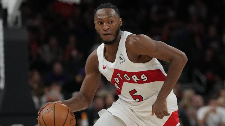 Toronto Raptors guard Immanuel Quickley (5) against the Phoenix Suns during the first half of an NBA basketball game, Sunday, March 23, 2026, in Phoenix. (Rick Scuteri/AP)
