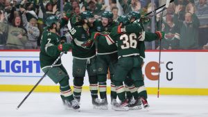 Minnesota Wild defenceman Quinn Hughes, second from the left, celebrates with teammates after scoring during the third period of Game 6 in the first round of the NHL hockey Stanley Cup playoff series against the Dallas Stars, Thursday, April 30, 2026, in St. Paul, Minn. (Bailey Hillesheim/AP)