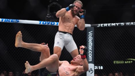 Justin-Gaethje-falls-to-the-mat-against-Rafael-Fiziev-during-their-UFC-313-mixed-martial-arts-lightweight-bout-in-Las-Vegas