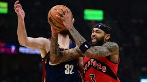 Toronto Raptors forward Brandon Ingram drives on Cleveland Cavaliers forward Dean Wade during the first half in Game 1 of a first-round NBA playoffs basketball series, Saturday, April 18, 2026, In Cleveland. (David Dermer/AP)