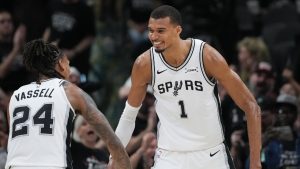 San Antonio Spurs forward/center Victor Wembanyama (1) reacts with guard/forward Devin Vassell (24) after a play during the second half in Game 5 of a first-round NBA playoffs basketball series in San Antonio, Tuesday, April 28, 2026. (Eric Gay/AP)