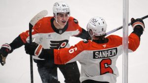 Philadelphia Flyers' Travis Sanheim (6) celebrates with Porter Martone (94) after scoring during the third period of Game 1 in the first round of the NHL Stanley Cup playoffs against the Pittsburgh Penguins in Pittsburgh, Saturday, April 18, 2026. (Gene J. Puskar/AP)
