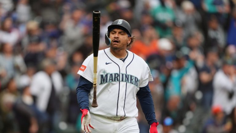 Seattle Mariners' Josh Naylor flips his bat after hitting his second home run of the game, a two-run home run during the third inning of a baseball game against the Houston Astros, Monday, April 13, 2026, in Seattle. (Lindsey Wasson/AP)