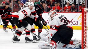 Ottawa Senators goaltender Linus Ullmark (35) has the shot of Carolina Hurricanes' Nikolaj Ehlers (27) go wide of the net with Senators' Jake Sanderson (85) nearby during the second period of Game 2 of an NHL hockey Stanley Cup first-round playoff series in Raleigh, N.C., Monday, April 20, 2026. (Karl DeBlaker/AP)