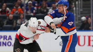New York Islanders' Anders Lee (27) fights Ottawa Senators' Brady Tkachuk (7) during the first period of an NHL hockey game Saturday, April 11, 2026, in Elmont, N.Y. (Frank Franklin II/AP)