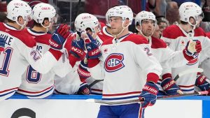 Monteal Canadiens left wing Juraj Slafkovsky (20) celebrates with the bench after his goal against the Tampa Bay Lightning during the second period in Game 1 of an NHL hockey Stanley Cup first-round playoff series, Sunday, April 19, 2026, in Tampa, Fla. (AP Photo/Chris O'Meara)