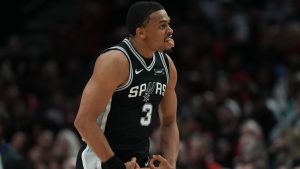 San Antonio Spurs forward Keldon Johnson (3) reacts after scoring against the Portland Trail Blazers during the second half in Game 3 of a first-round NBA playoffs basketball series in Portland, Ore, Friday, April 24, 2026. (Jenny Kane/AP)