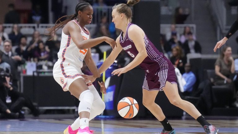 Toronto Tempo Kristy Wallace (5) battles for the ball with Connecticut Sun Rayah Marshall (25) during first half pre-season WNBA basketball action in Toronto on Wednesday, April 29, 2026. (Nathan Denette/CP)