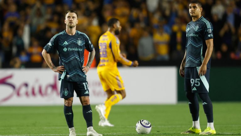 Albert Rusnak, left, and Osaze De Rosario of the United States' Seattle Sounders stand on the pitch during a Concacaf Champions Cup quarterfinal first leg soccer match against Mexico's Tigres in Monterrey, Mexico, Wednesday, April 8, 2026. (Jorge Mendoza/AP)