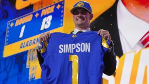 Alabama quarterback Ty Simpson poses after being chosen by the Los Angeles Rams with the 13th overall pick during the first round of the NFL draft, Thursday, April 23, 2026, in Pittsburgh. (AP/Gene J. Puskar)