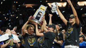 UCLA players celebrate after defeating South Carolina in the women's National Championship Final Four NCAA college basketball tournament game, Sunday, April 5, 2026, in Phoenix. (Rick Scuteri/AP)