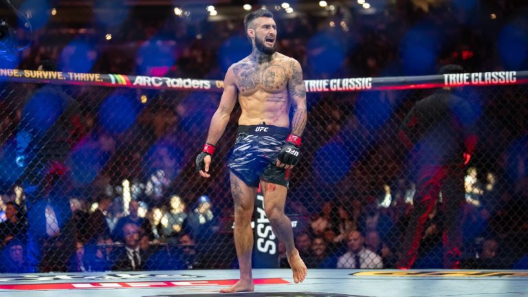 Charles Jourdain celebrates after winning a UFC fight. (Ethan Cairns/CP)