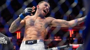 Brazil's Carlos Prates celebrates after earning a knockout win in the UFC's welterweight division. (Yuki Iwamura/AP)