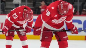 Detroit Red Wings left wing Lucas Raymond (23) and Andrew Copp (18) skate to the locker room after an NHL hockey game against the Minnesota Wild Sunday, April 5, 2026, in Detroit. (AP Photo/Paul Sancya)