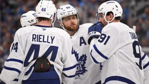 The Toronto Maple Leafs converse during during a stoppage in play during the third period of an NHL hockey game against the St. Louis Blues Saturday, March 28, 2026, in St. Louis. (AP Photo/Connor Hamilton)