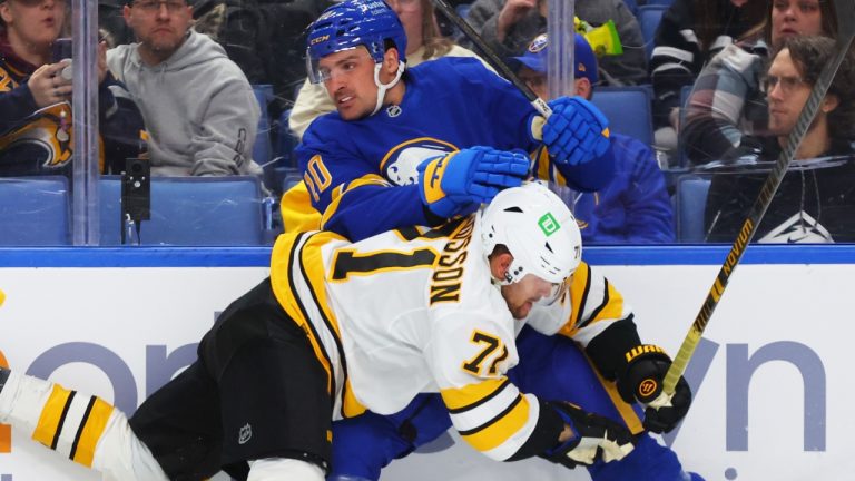 Boston Bruins left wing Viktor Arvidsson (71) and Buffalo Sabres center Sam Carrick (10) collide during the second period of an NHL hockey game Wednesday, March 25, 2026, in Buffalo, N.Y. (AP Photo/Jeffrey T. Barnes)