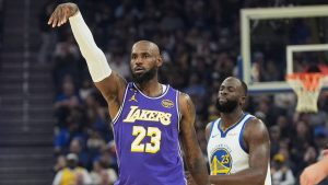 Los Angeles Lakers forward LeBron James, left, reacts after making a 3-point basket in front of Golden State Warriors forward Draymond Green during the first half of an NBA basketball game in San Francisco, Thursday, April 9, 2026. (AP Photo/Jeff Chiu)