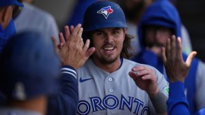 Toronto Blue Jays' Addison Barger celebrates after scoring on a double by Alejandro Kirk during the second inning of an MLB game against the Chicago White Sox, Friday, April 3, 2026, in Chicago. (AP Photo/Erin Hooley)