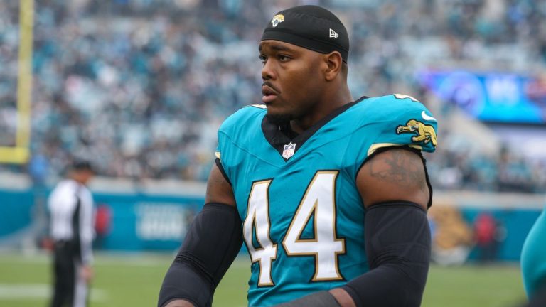 Jacksonville Jaguars defensive end Travon Walker (44) walks the sideline during an NFL football game against the Tennessee Titans, Sunday, Jan. 4, 2026, in Jacksonville, Fla. The Jaguars defeated the Titans 41-7. (AP Photo/Gary McCullough)