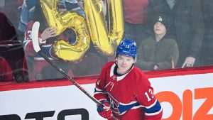 Montreal Canadiens' Cole Caufield skates by the No. 50 prior to an NHL game against the New Jersey Devils in Montreal, Sunday, April 5, 2026. (CP/Graham Hughes)
