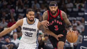 Memphis Grizzlies guard Rayan Rupert (32) defends against Toronto Raptors forward Brandon Ingram (3) during the first half of an NBA basketball game Friday, April 3, 2026, in Memphis, Tenn. (AP Photo/Nikki Boertman)