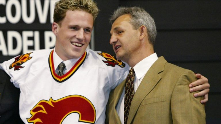 Dion Phaneuf, left, embraces Calgary Flames head coach Darryl Sutter, right, after Phaneuf was selected by the Flames ninth overall in the first round of the NHL draft on Saturday, June 21, 2003 in Nashville, Tenn. (CP Photo/Ryan Remiorz)