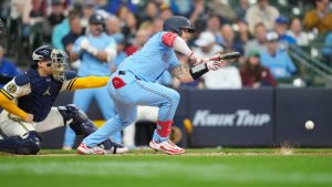 Toronto Blue Jays' Tyler Heineman drops a sacrifice bunt allowing Andrés Giménez to score during the third inning against the Milwaukee Brewers, Thursday, April 16, 2026, in Milwaukee. (AP Photo/Kayla Wolf)