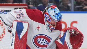 Montreal Canadiens goalie Jakub Dobes makes a save during the third period of an NHL game against the Vancouver Canucks, in Vancouver, on Saturday, Oct. 25, 2025. (CP/Darryl Dyck)