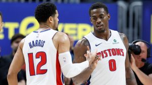 Detroit Pistons forward Tobias Harris (12) celebrates with center Jalen Duren (0) after a win over the Toronto Raptors in an NBA basketball game Tuesday, March 31, 2026, in Detroit. (AP Photo/Duane Burleson)