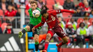 Toronto FC Raheem Edwards (44) and Austin FC Jon Gallagher (17) battle for the ball during first half MLS soccer action in Toronto on Saturday April 18, 2026. THE CANADIAN PRESS/Frank Gunn