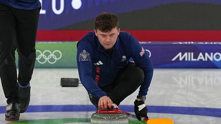 Britain's Bruce Mouat, centre, competes during a men's curling gold medal match between Britain and Canada, at the 2026 Winter Olympics, in Cortina d'Ampezzo, Italy, Saturday, Feb. 21, 2026. (AP Photo/Fatima Shbair)
