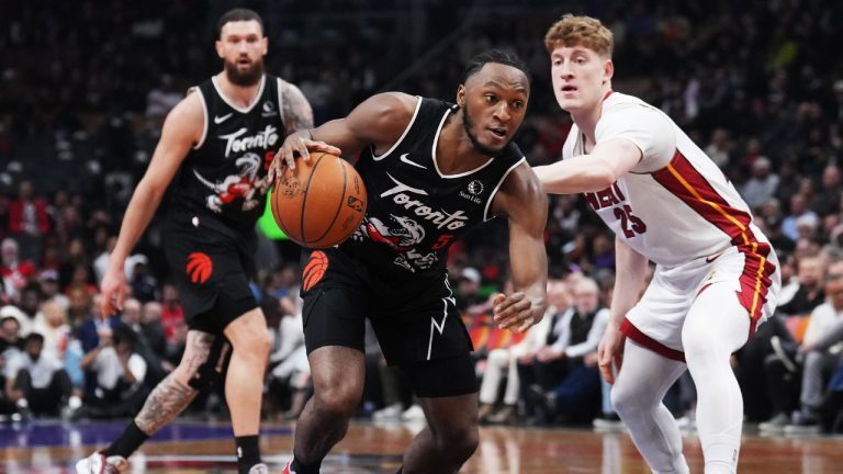 Toronto Raptors' Immanuel Quickley (5) drives past Miami Heat's Kasparas Jakucionis (25) during first half NBA basketball action in Toronto on Thursday, April 9, 2026. THE CANADIAN PRESS/Nathan Denette