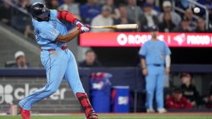 Toronto Blue Jays first baseman Vladimir Guerrero Jr. hits an RBI single during the fifth inning against the Boston Red Sox, in Toronto on Tuesday, April 28, 2026. (CP/Nathan Denette)