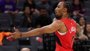Toronto Raptors guard A.J. Lawson reacts after making a 3-point shot against the Sacramento Kings during the second half of an NBA basketball preseason game Wednesday, Oct. 8, 2025, in Sacramento, Calif. (AP Photo/Scott Marshall)