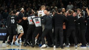 Minnesota Timberwolves and Denver Nuggets players get into an altercation during the second half of Game 4 of a first-round NBA basketball playoff series, Saturday, April 25, 2026, in Minneapolis. (AP Photo/Abbie Parr)