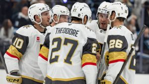 Vegas Golden Knights huddle on the ice during the first period of Game 3 of the first round NHL hockey Stanley Cup playoff series against the Utah Mammoth, Friday, April 24, 2026, in Salt Lake City. (AP Photo/Melissa Majchrzak)