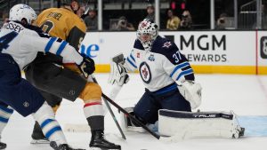 Vegas Golden Knights center Jack Eichel (9) attempts a shot on Winnipeg Jets goaltender Connor Hellebuyck (37) during the second period of an NHL hockey game Monday, April 13, 2026, in Las Vegas. (John Locher/AP)