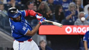 Toronto Blue Jays designated hitter Vladimir Guerrero Jr. (27) hits an RBI single against the Cleveland Guardians in first inning MLB baseball game action in Toronto on Sunday, April 26, 2026. (Jon Blacker/CP)