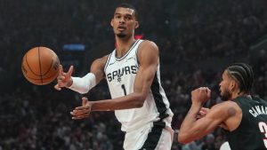 San Antonio Spurs forward/centre Victor Wembanyama passes the ball around Portland Trail Blazers forward Toumani Camara during the first half in Game 4 of a first-round NBA playoffs series in Portland, Ore., Sunday, April 26, 2026. (AP/Jenny Kane)
