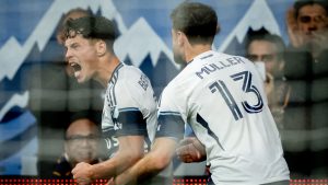Vancouver Whitecaps' Sebastian Berhalter (16) celebrates his goal against the Portland Timbers with Thomas Muller (13) during the second half of an MLS soccer match in Vancouver, on Saturday, April 4, 2026. (Ethan Cairns/CP)