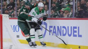 Minnesota Wild centre Joel Eriksson Ek (14) and Dallas Stars defenceman Ilya Lyubushkin (46) battle for the puck during the first period of Game 6 in the first round of the NHL hockey Stanley Cup playoff series Thursday, April 30, 2026, in St. Paul, Minn. (Bailey Hillesheim/AP)