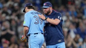 Toronto Blue Jays manager John Schneider gives pitcher Trey Yesavage (39) a pat on the back as he pulls him from the game during fifth inning MLB baseball action against the Boston Red Sox, in Toronto on Tuesday, April 28, 2026. (Nathan Denette/CP)